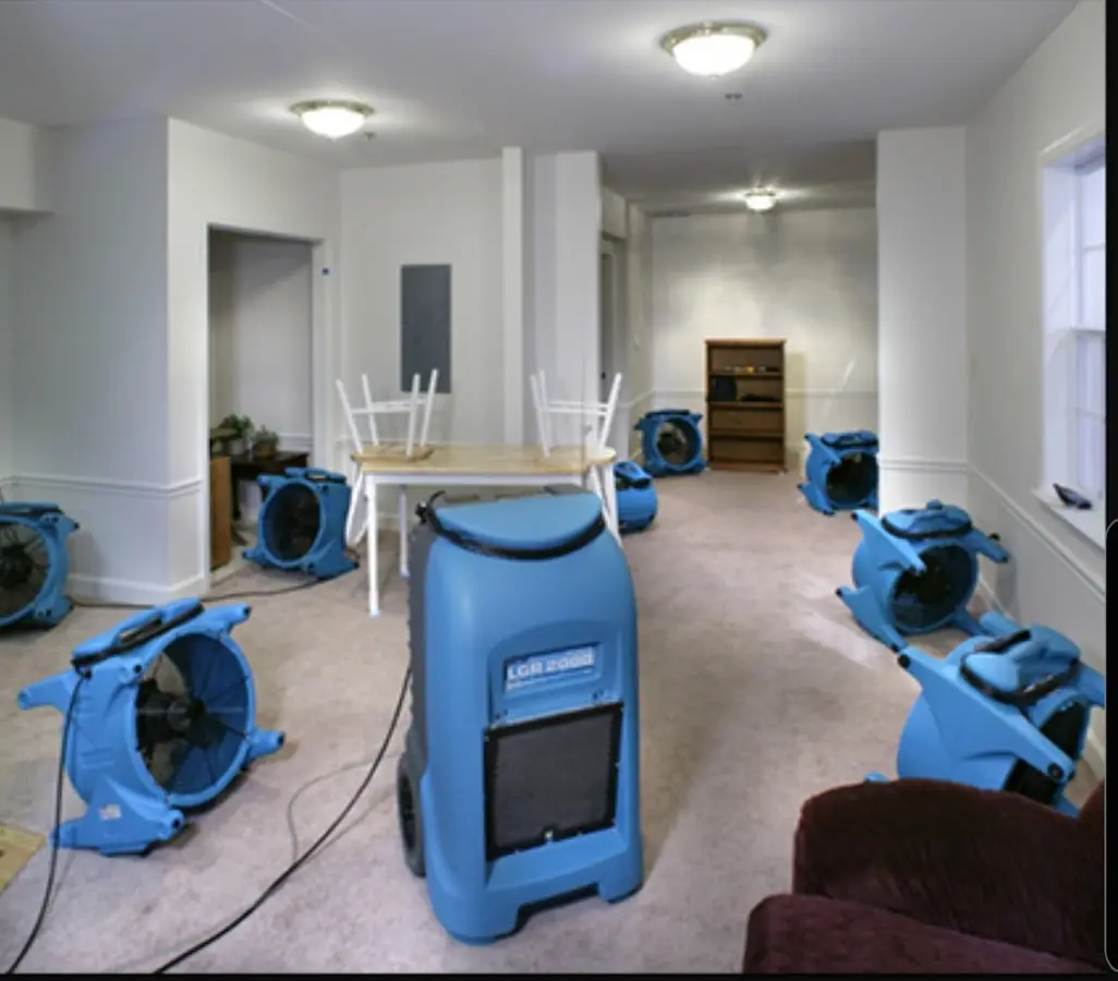 Air movers and dehumidifier setup for Water Damage Restoration in San Juan